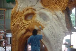 Guy spraying rigid foam tree