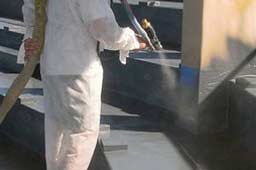 Concrete Coating being sprayed on surface